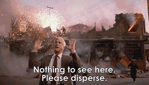 Leslie Nielsen asking people to disperse whilst chaos explodes behind him, from the Naked Gun film.